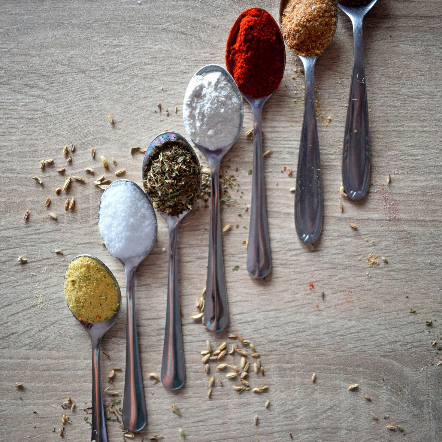 Diverse group of community members sharing a meal together, showcasing the social bonds formed through collaborative cooking